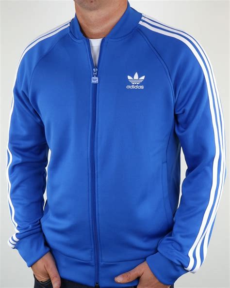 white blue adidas tracksuit top.